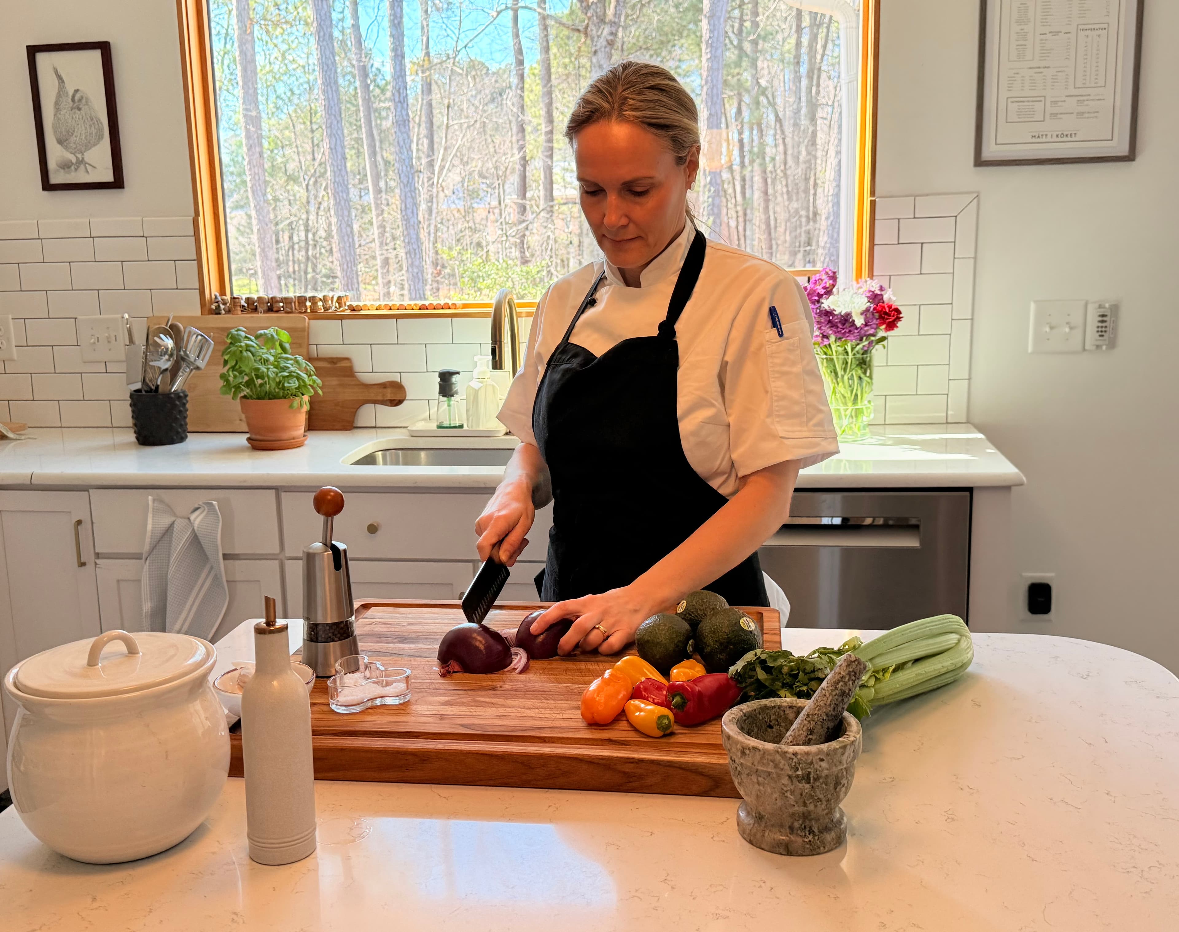 Chef Ellen preparing fresh vegetables in a client's kitchen